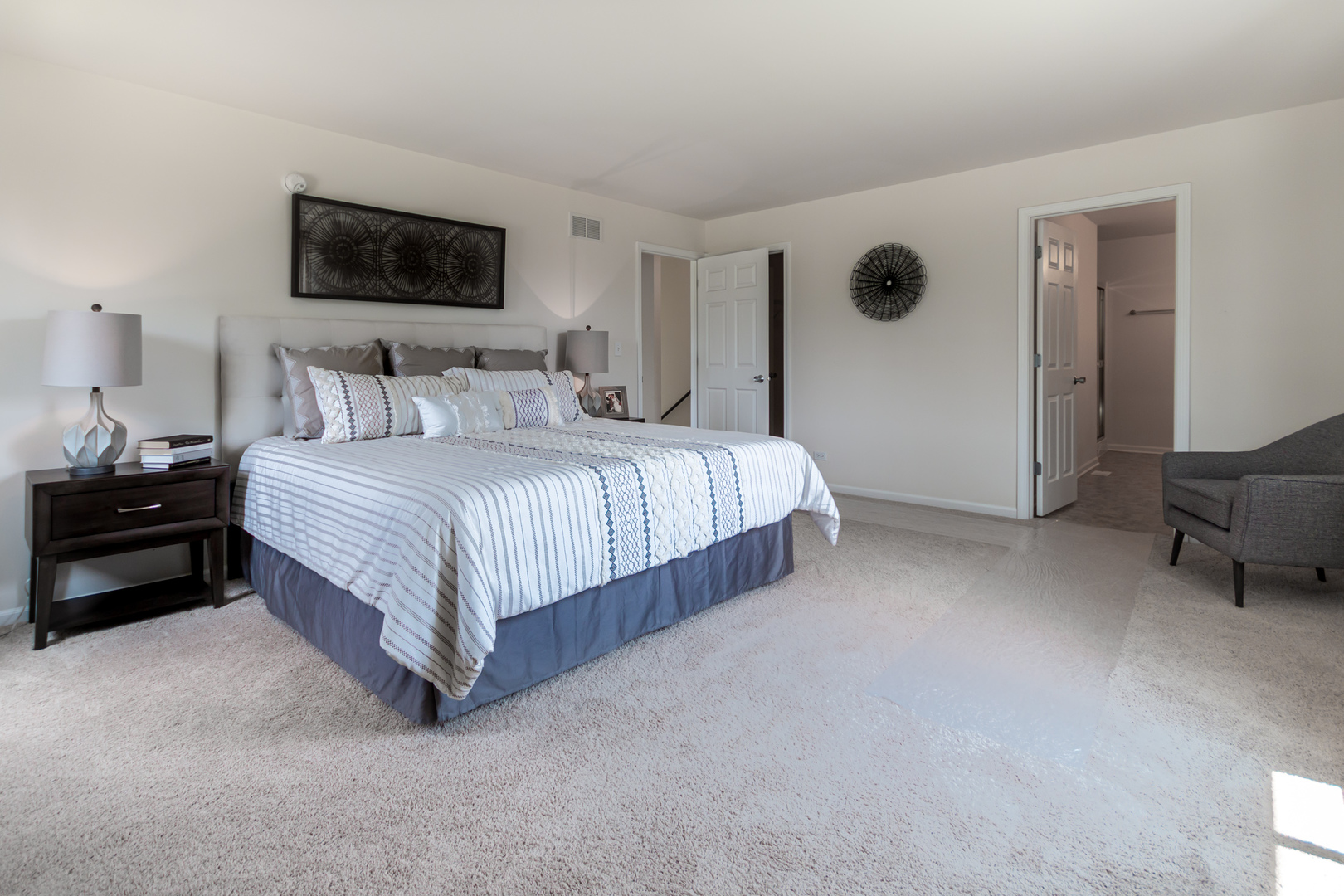 901 Willow Road Manteno, IL 60950 - Photo 10 of 17 a spacious bedroom with a bed and a chair