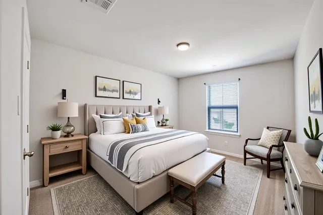 a bedroom with a bed and a couch