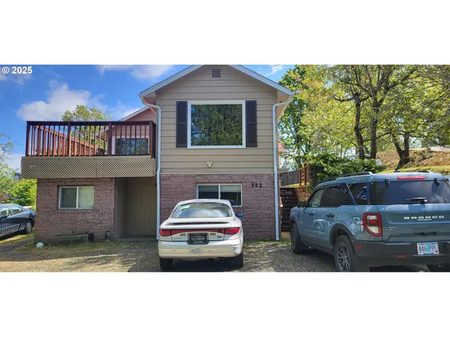 a front view of a house with parking space