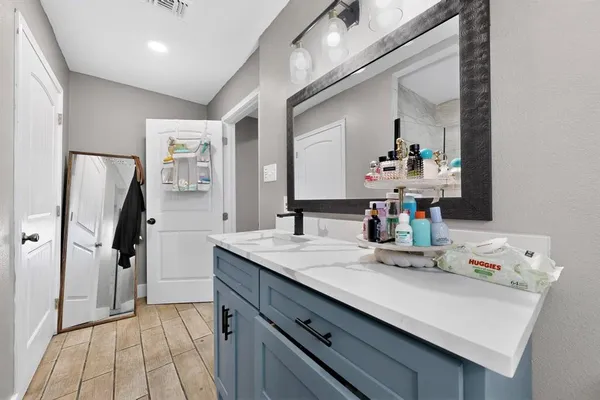 a bathroom with a sink and a mirror
