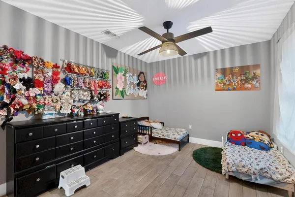 a bed room with a bed and a window