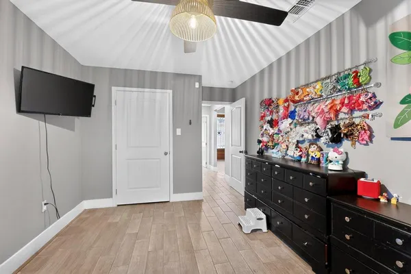 a room with furniture and a flat screen tv