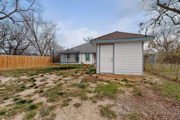 a house view with a backyard space