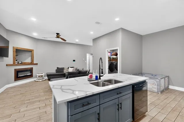 a bathroom with a sink double vanity granite and a mirror