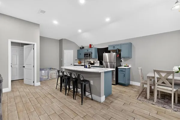 a kitchen with a table and chairs in it