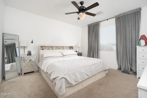 a view of a livingroom with workspace and a window
