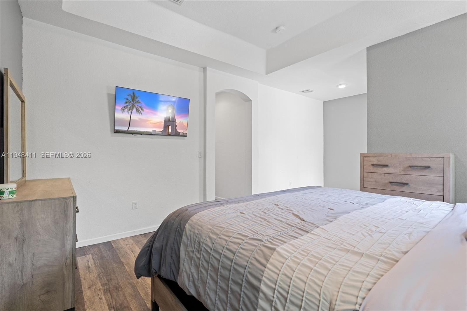 550 Northeast 33rd Terrace Homestead, FL 33033 - Photo 19 of 31 a bedroom with a bed and a flat screen tv