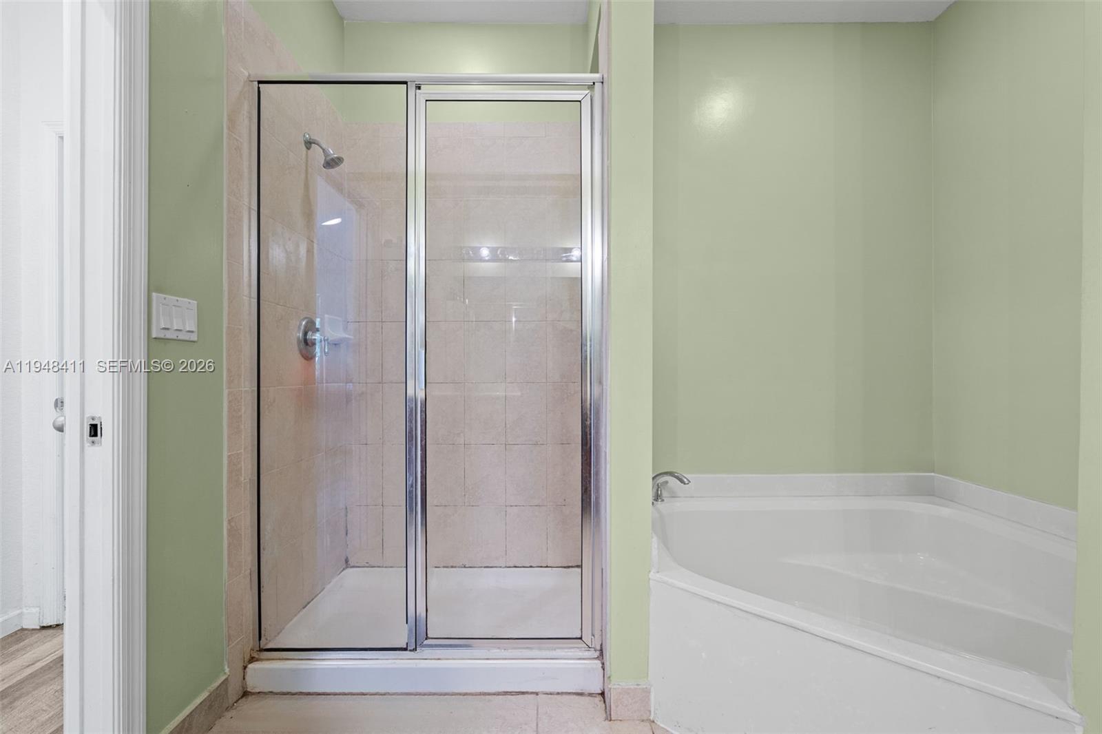 550 Northeast 33rd Terrace Homestead, FL 33033 - Photo 24 of 31 a bathroom with a bathtub and shower