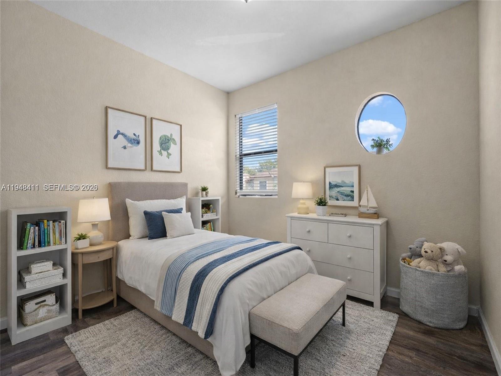 550 Northeast 33rd Terrace Homestead, FL 33033 - Photo 28 of 31 a bedroom with a bed and a chandelier