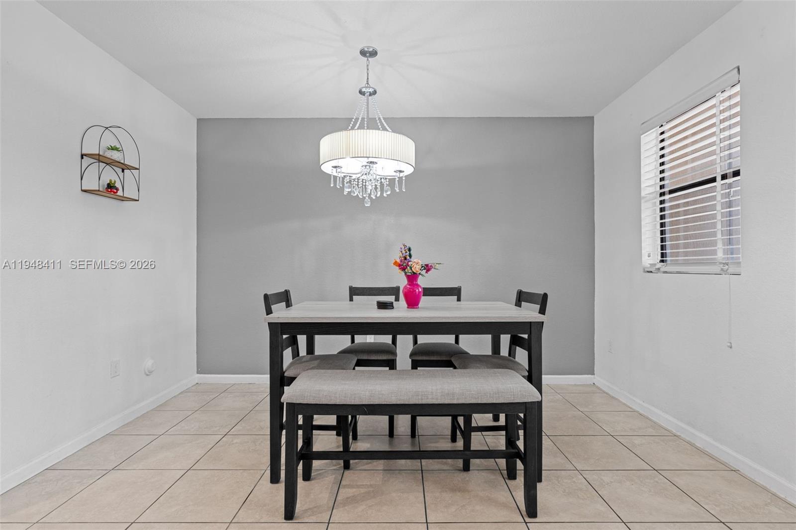 550 Northeast 33rd Terrace Homestead, FL 33033 - Photo 6 of 31 a view of a dining room with furniture and a chandelier
