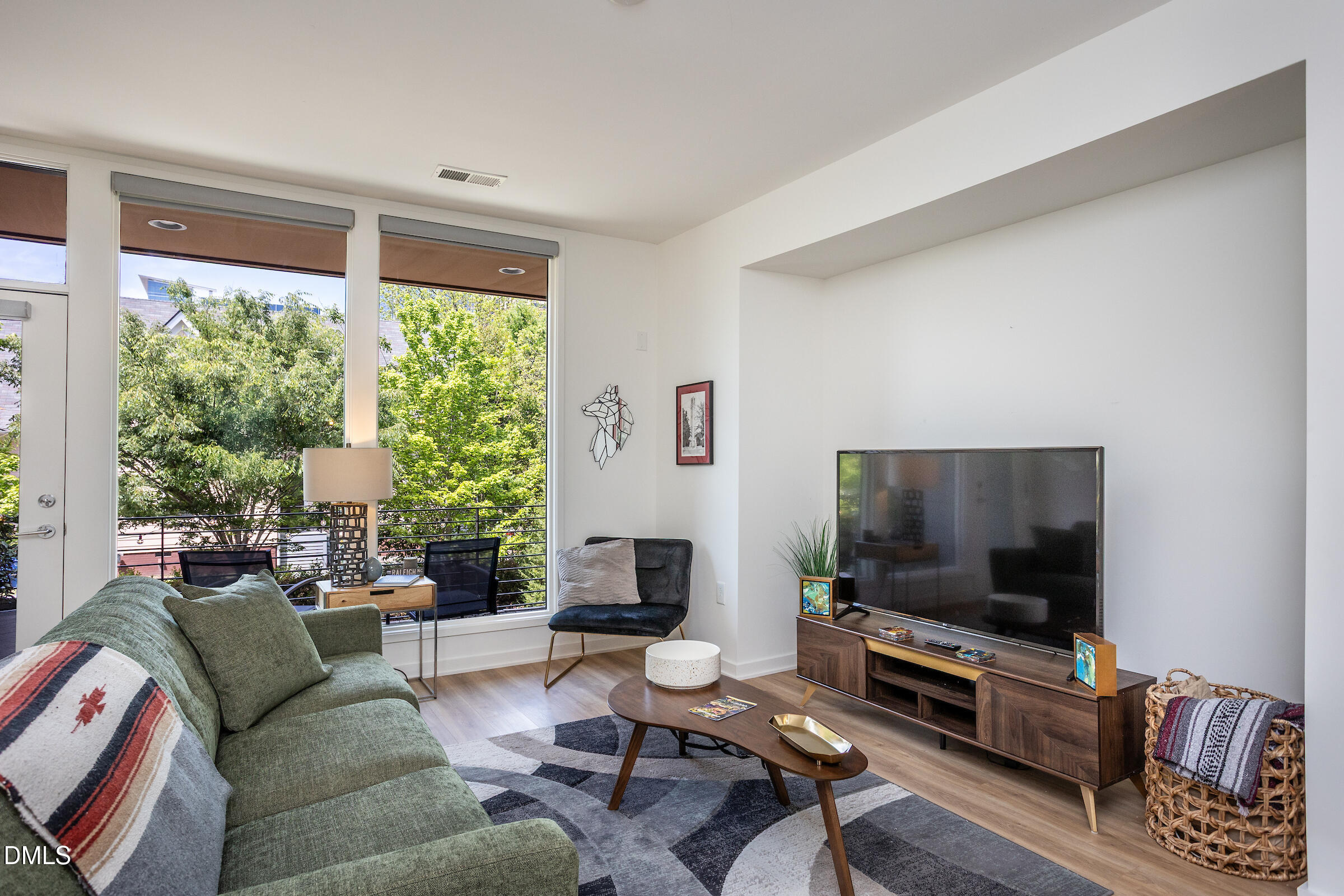 536 South Person Street Raleigh, NC 27601 - Photo 16 of 31 a living room with furniture and a flat screen tv