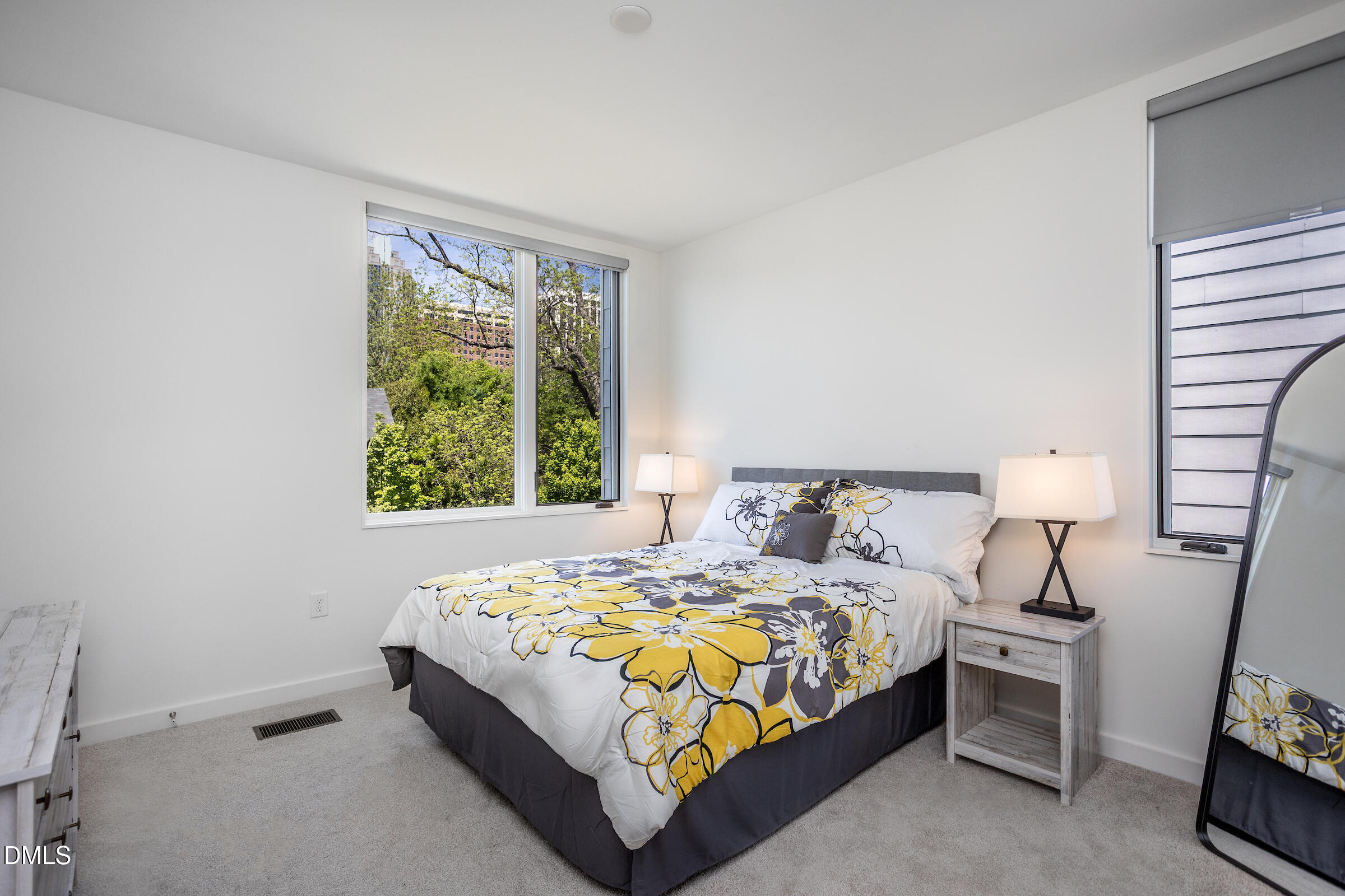 536 South Person Street Raleigh, NC 27601 - Photo 22 of 31 a bedroom with a bed and a window