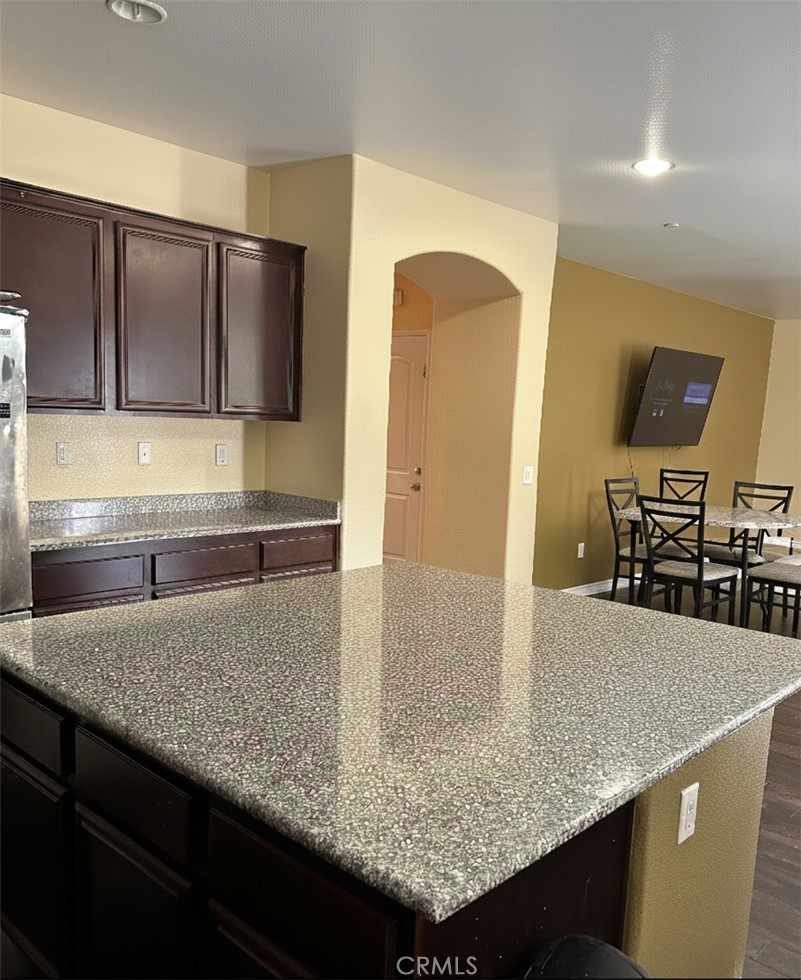 15068 Brucite Road Victorville, CA 92394 - Photo 6 of 10 a kitchen with granite countertop counter top space cabinets and stainless steel appliances