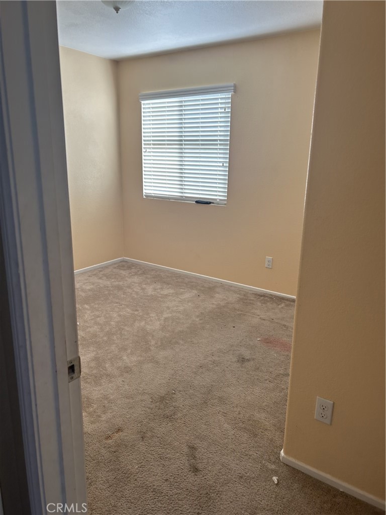 15068 Brucite Road Victorville, CA 92394 - Photo 8 of 10 an empty room with a window
