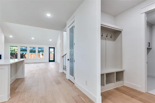a view of hallway with wooden floor