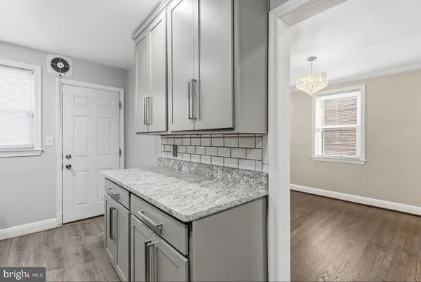 an view of cabinets and wooden floor