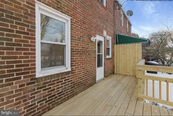 a view of a brick house with a wooden door