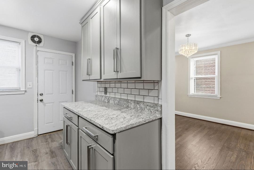 5102 Plymouth Road Baltimore, MD 21214 - Photo 10 of 32 an view of cabinets and wooden floor