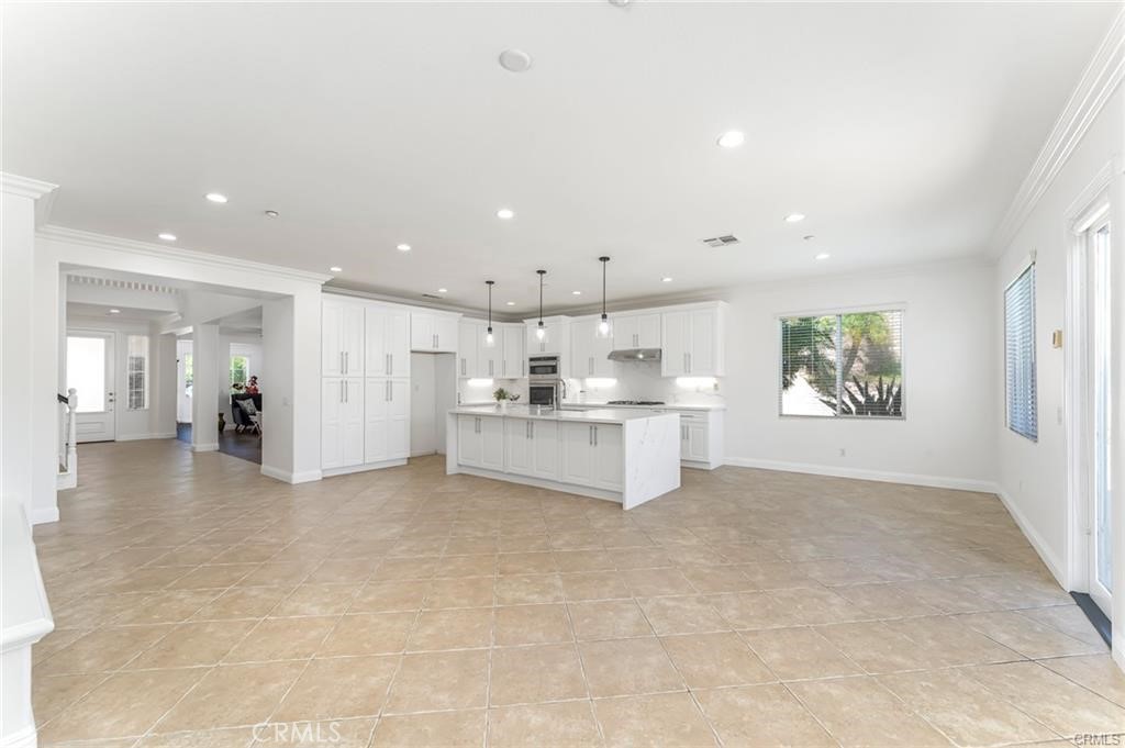 540 Boxcar Lane Brea, CA 92823 - Photo 11 of 36 a view of a kitchen with a sink and white cabinets