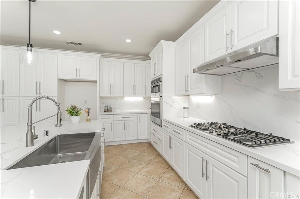 540 Boxcar Lane Brea, CA 92823 - Photo 12 of 36 a kitchen with stainless steel appliances granite countertop a sink stove and cabinets