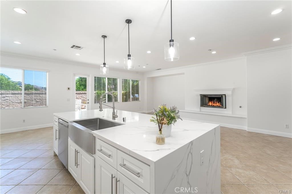 540 Boxcar Lane Brea, CA 92823 - Photo 13 of 36 a kitchen with stainless steel appliances granite countertop a sink a oven a counter space and a view of living room