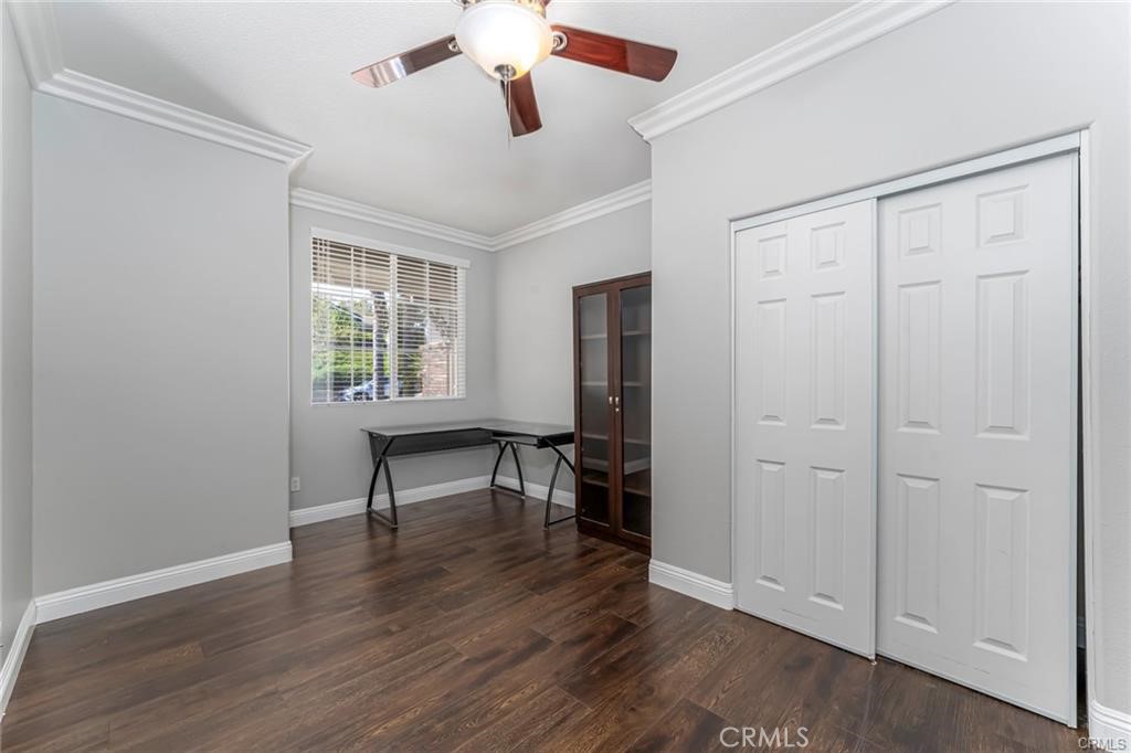 540 Boxcar Lane Brea, CA 92823 - Photo 15 of 36 an empty room with wooden floor fan and windows