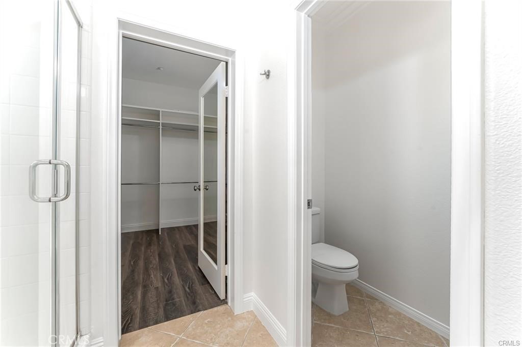 540 Boxcar Lane Brea, CA 92823 - Photo 18 of 36 a bathroom with a toilet and a shower