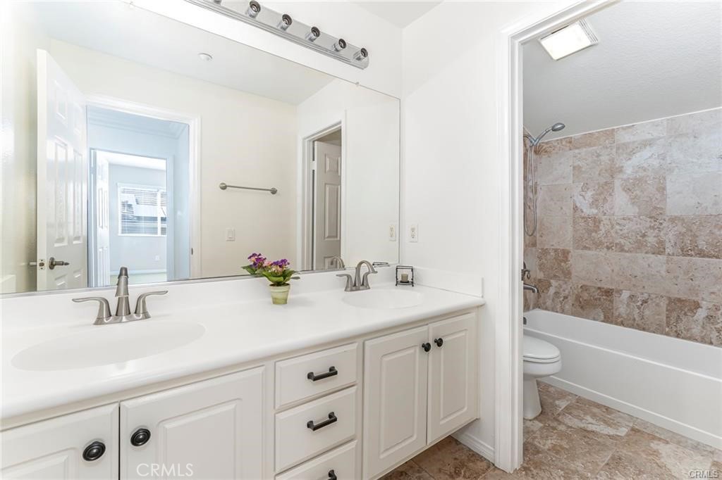 540 Boxcar Lane Brea, CA 92823 - Photo 24 of 36 a bathroom with a double vanity sink toilet and shower