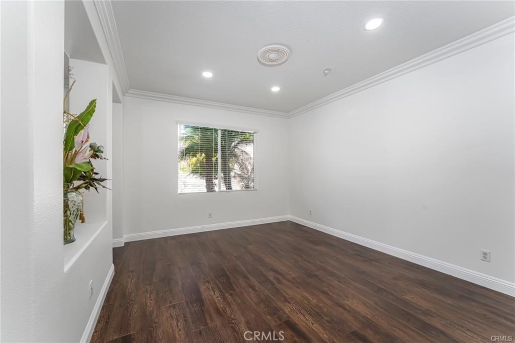 540 Boxcar Lane Brea, CA 92823 - Photo 7 of 36 an empty room with window and wooden floor