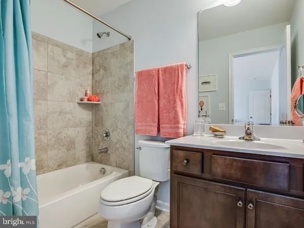 a bathroom with a sink a toilet and a bathtub