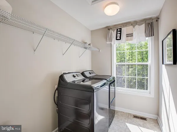 a utility room with window washer and dryer