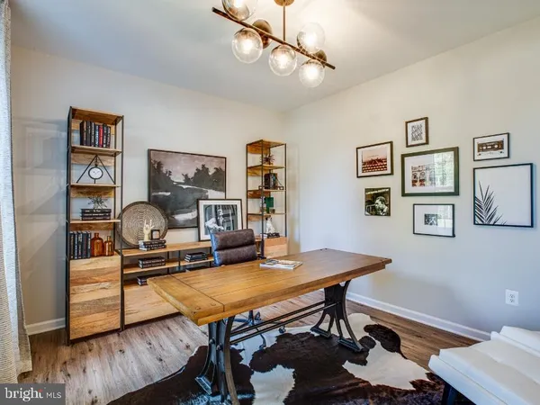 a workspace with furniture and wooden floor