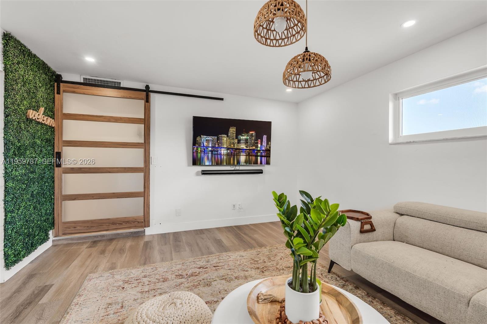 10971 Southwest 177th Street Miami, FL 33157 - Photo 12 of 41 a view of a livingroom with furniture and a potted plant