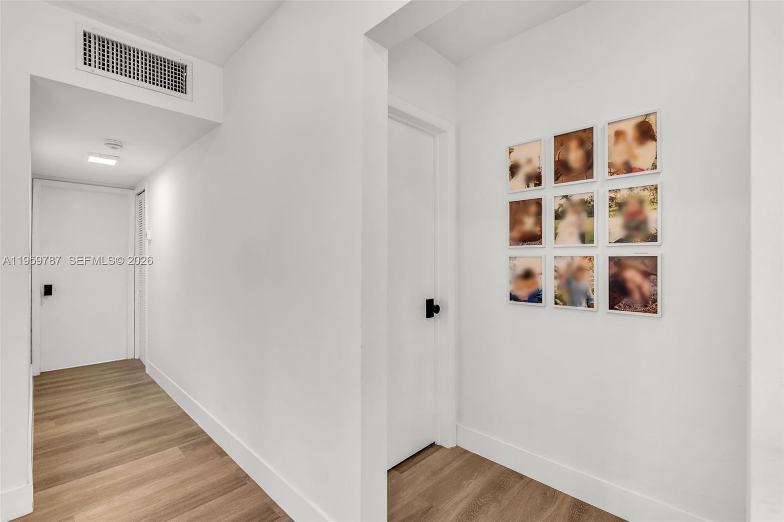 10971 Southwest 177th Street Miami, FL 33157 - Photo 14 of 41 a view of a hallway with wooden floor
