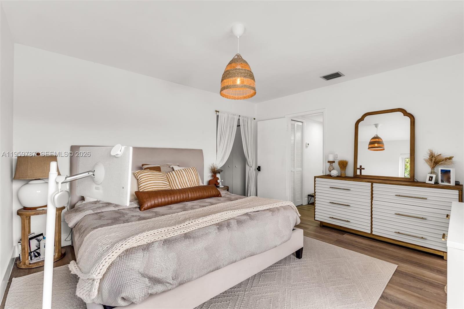 10971 Southwest 177th Street Miami, FL 33157 - Photo 15 of 41 a bedroom with a bed and a dresser