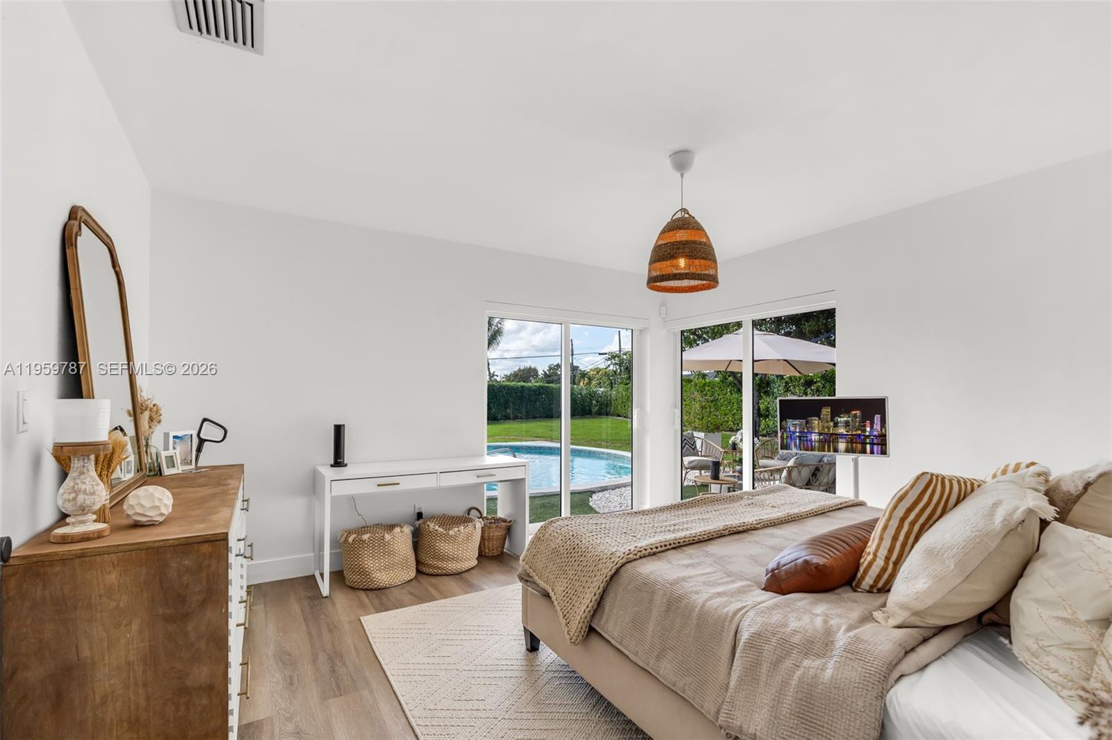 10971 Southwest 177th Street Miami, FL 33157 - Photo 16 of 41 a bedroom with a bed and a large window