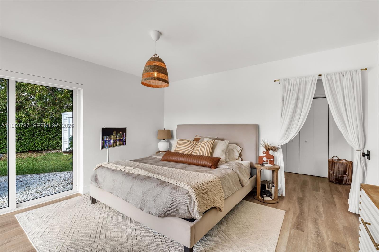 10971 Southwest 177th Street Miami, FL 33157 - Photo 17 of 41 a bedroom with a bed and a large window
