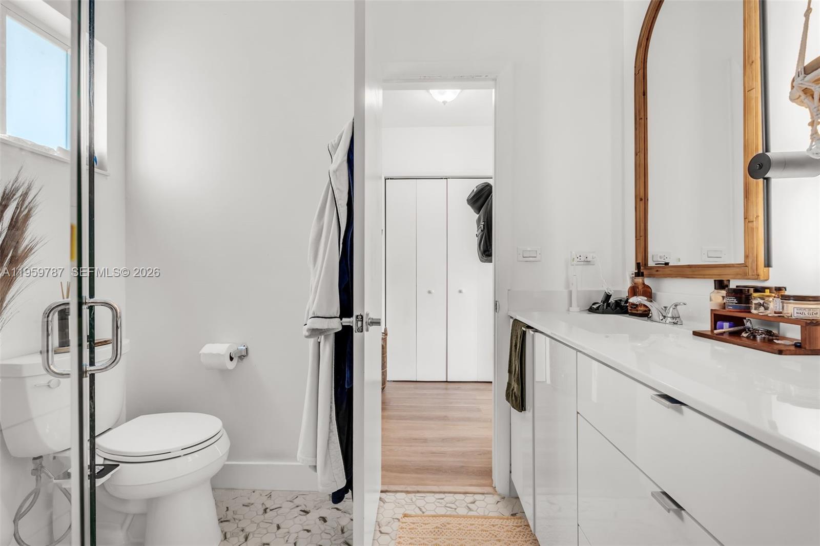 10971 Southwest 177th Street Miami, FL 33157 - Photo 18 of 41 a bathroom with a sink a toilet and shower