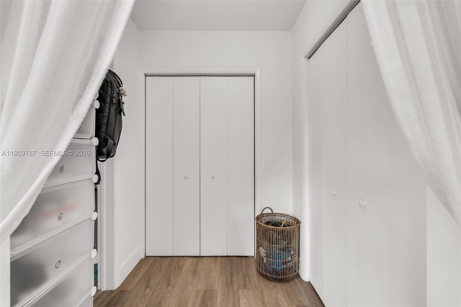 10971 Southwest 177th Street Miami, FL 33157 - Photo 20 of 41 a view of walk in closet with empty racks