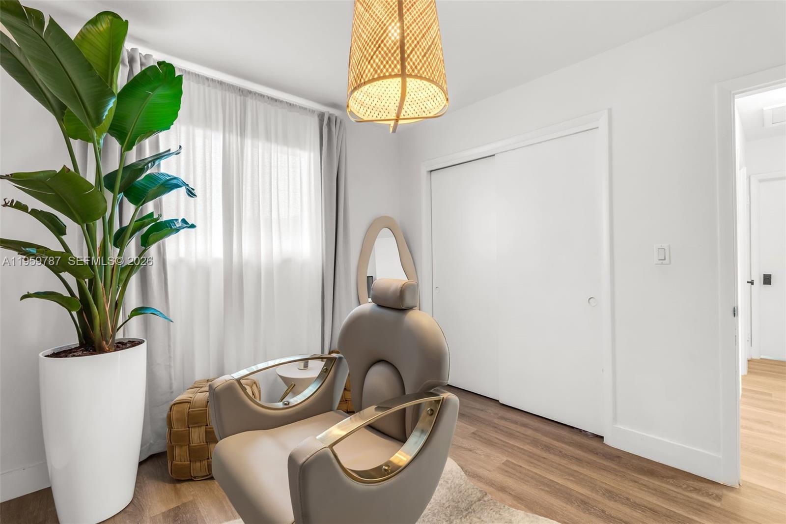 10971 Southwest 177th Street Miami, FL 33157 - Photo 25 of 41 a view of a room that has a plant and a window