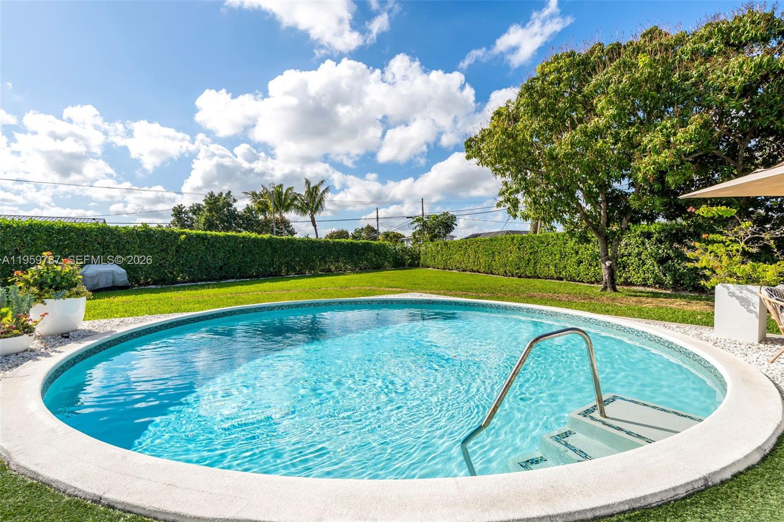 10971 Southwest 177th Street Miami, FL 33157 - Photo 28 of 41 a view of swimming pool with outdoor seating