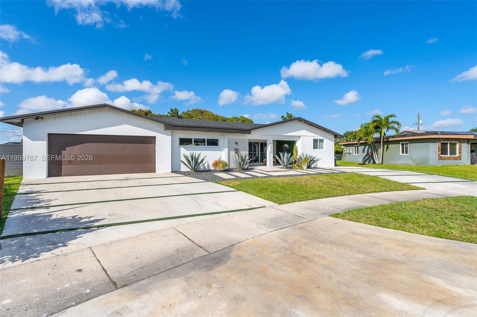 10971 Southwest 177th Street Miami, FL 33157 - Photo 3 of 41 a view of house with outdoor space and swimming pool