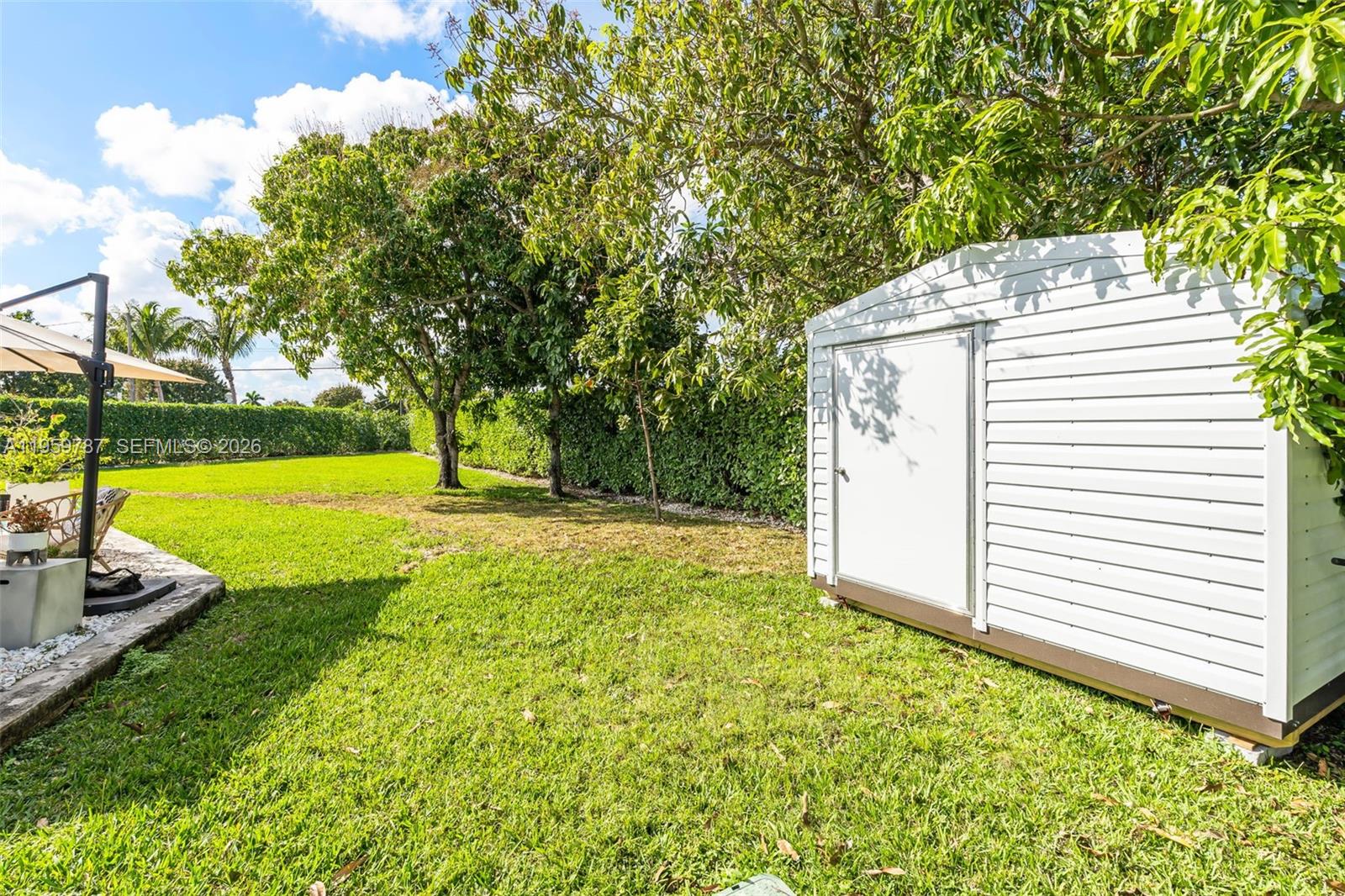 10971 Southwest 177th Street Miami, FL 33157 - Photo 32 of 41 a view of a house with backyard