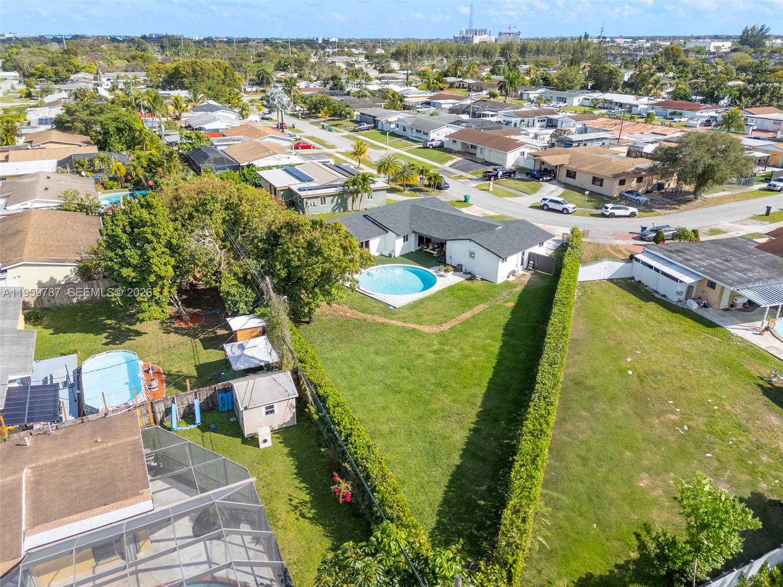 10971 Southwest 177th Street Miami, FL 33157 - Photo 34 of 41 an aerial view of residential houses with outdoor space