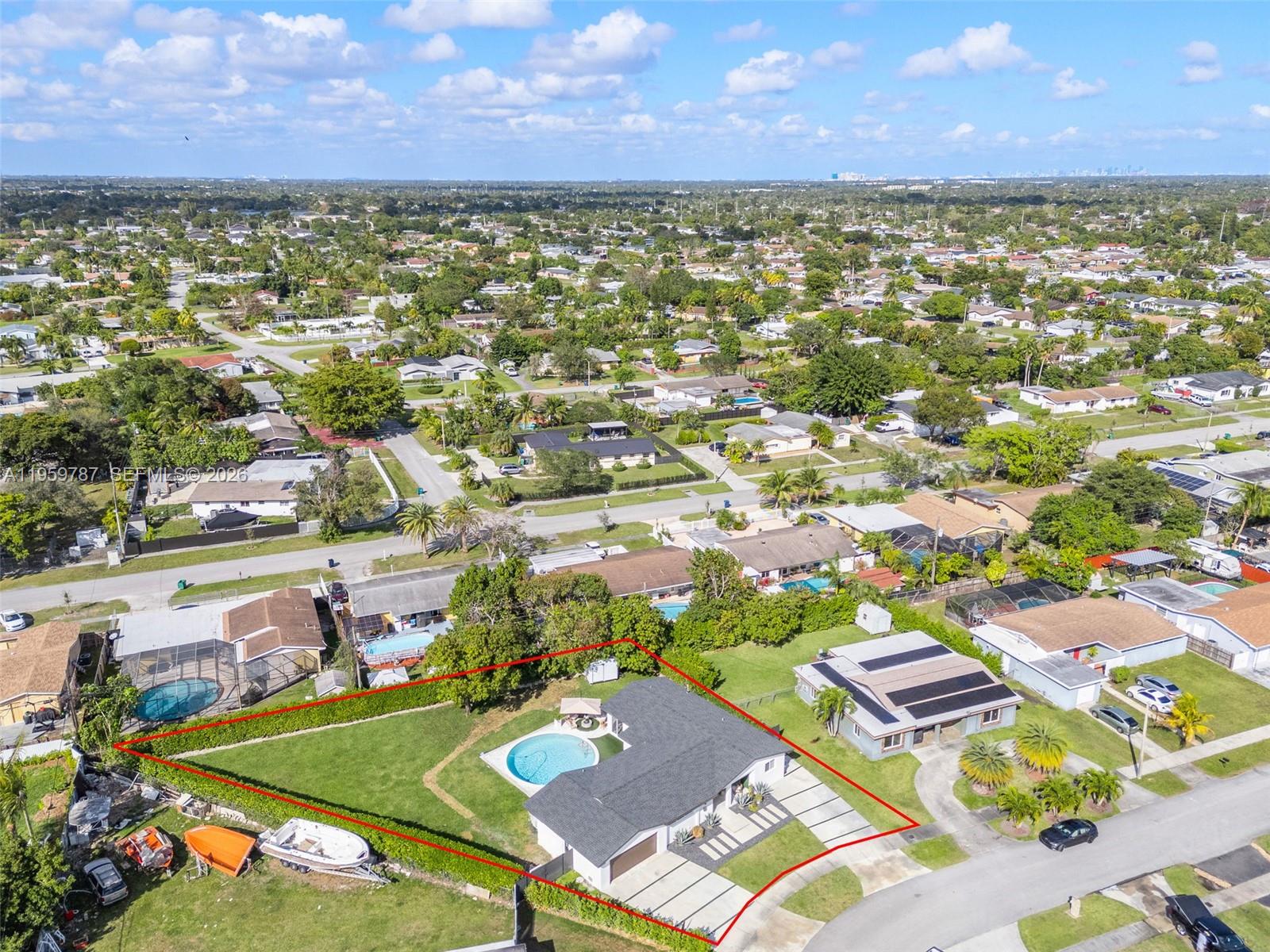 10971 Southwest 177th Street Miami, FL 33157 - Photo 35 of 41 an aerial view of residential houses with outdoor space and a lake view