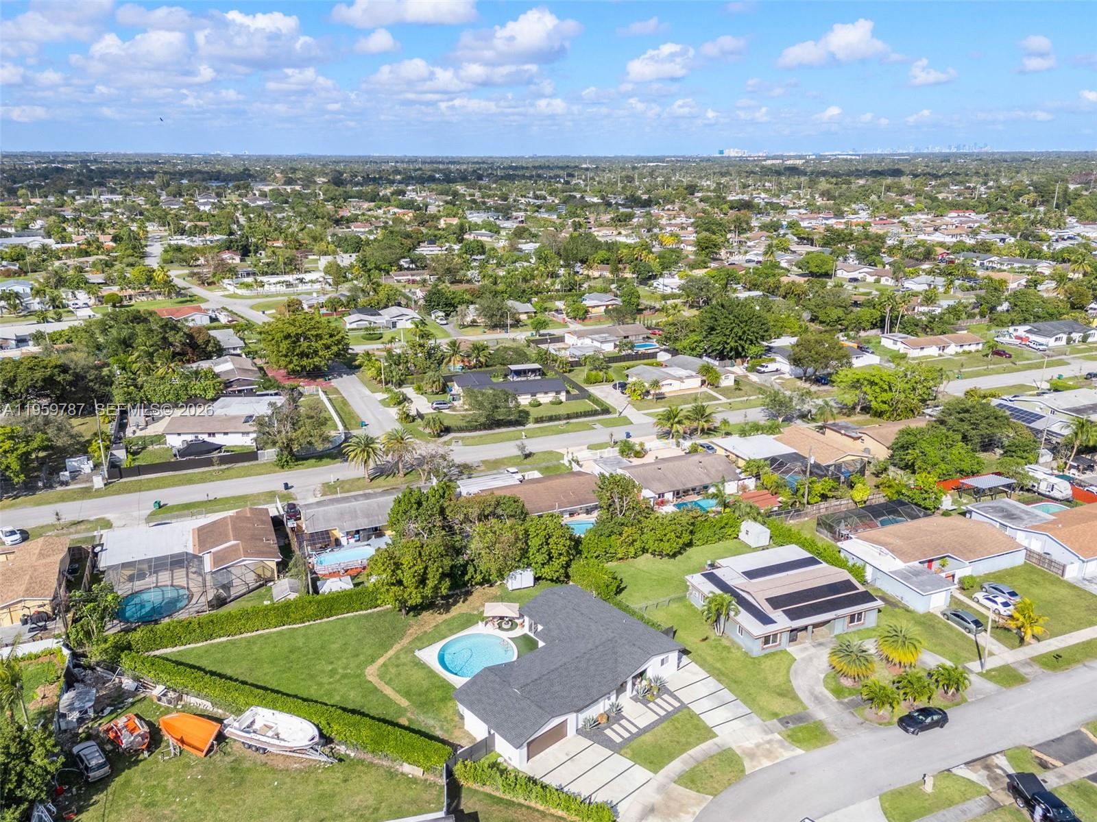 10971 Southwest 177th Street Miami, FL 33157 - Photo 36 of 41 an aerial view of residential houses with outdoor space and a lake view