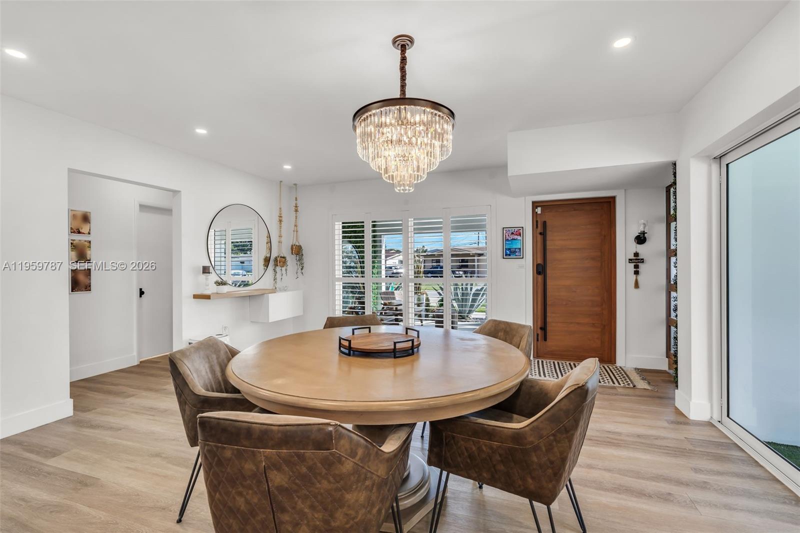 10971 Southwest 177th Street Miami, FL 33157 - Photo 6 of 41 a view of a dining room with furniture window and wooden floor