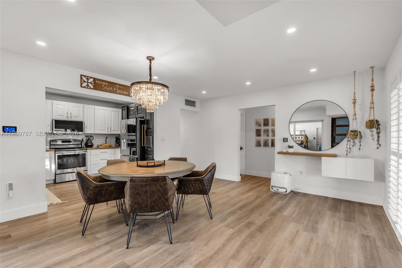 10971 Southwest 177th Street Miami, FL 33157 - Photo 10 of 41 a view of a dining room with furniture window and wooden floor