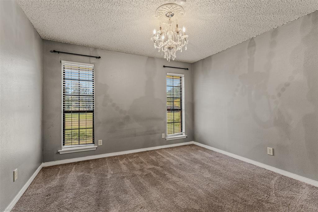 9510 South State Highway Scurry, TX 75158 - Photo 12 of 26 a view of an empty room with a window