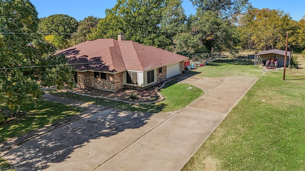 9510 South State Highway Scurry, TX 75158 - Photo 3 of 26 a view of a house with a yard